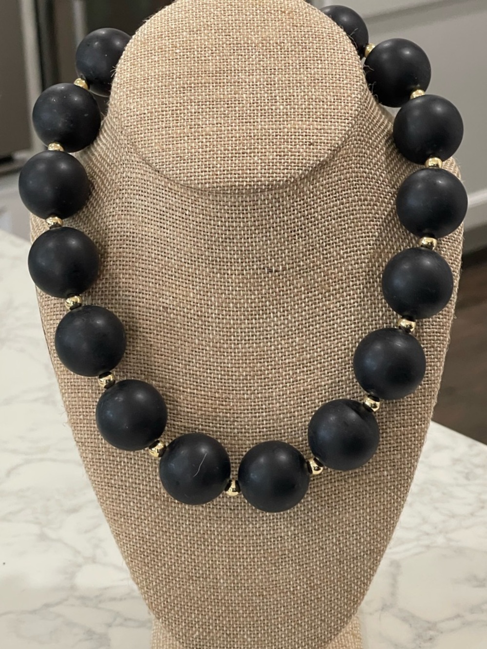 Elegant Matte Black Bead Necklace with Gold Accents